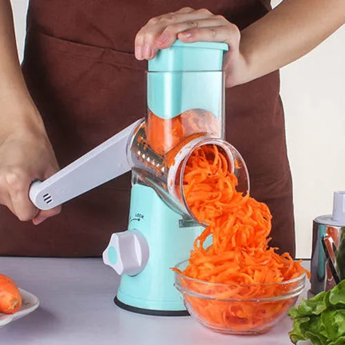 Blue manual mandoline vegetable slicer with stainless steel blade on a kitchen counter.