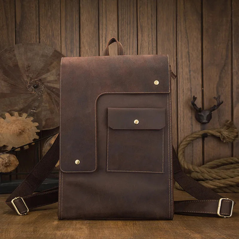 Dark brown genuine leather men's travel bag with shoulder straps and vertical square shape