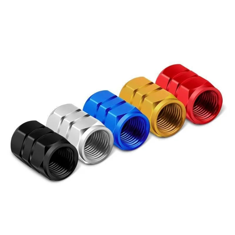 Set of ten aluminium alloy car valve caps in blue, red, silver, gold and black on a white background