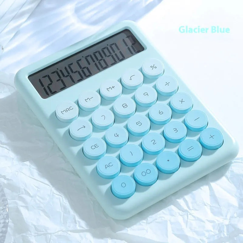 12-digit gradient colour desktop calculator in violet, blue, green, or pink on a desk