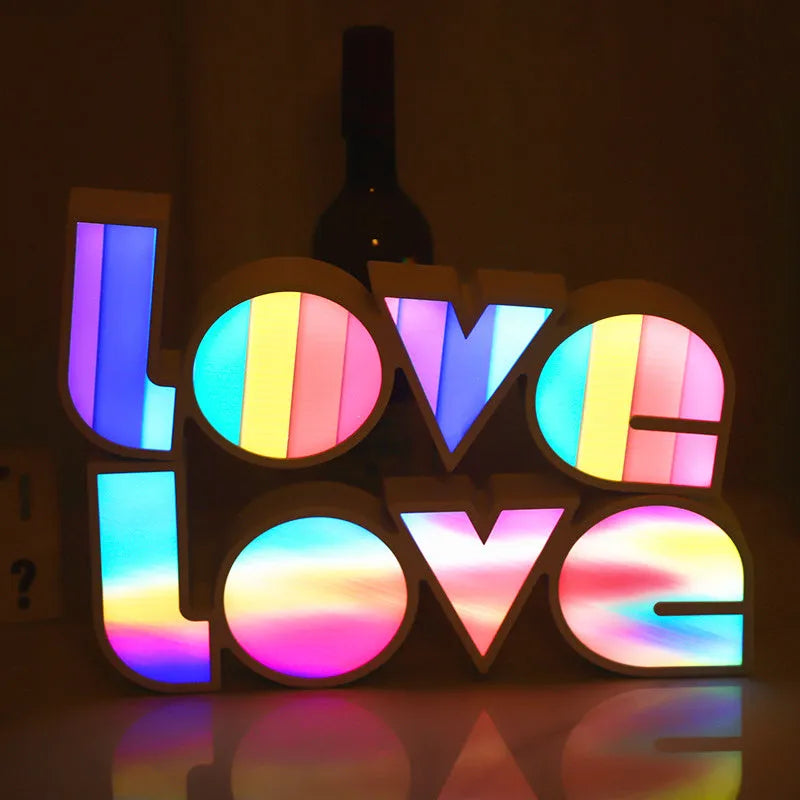 Rainbow style LOVE word LED decorative light with USB cable, measuring 35.5cm by 13.5cm.