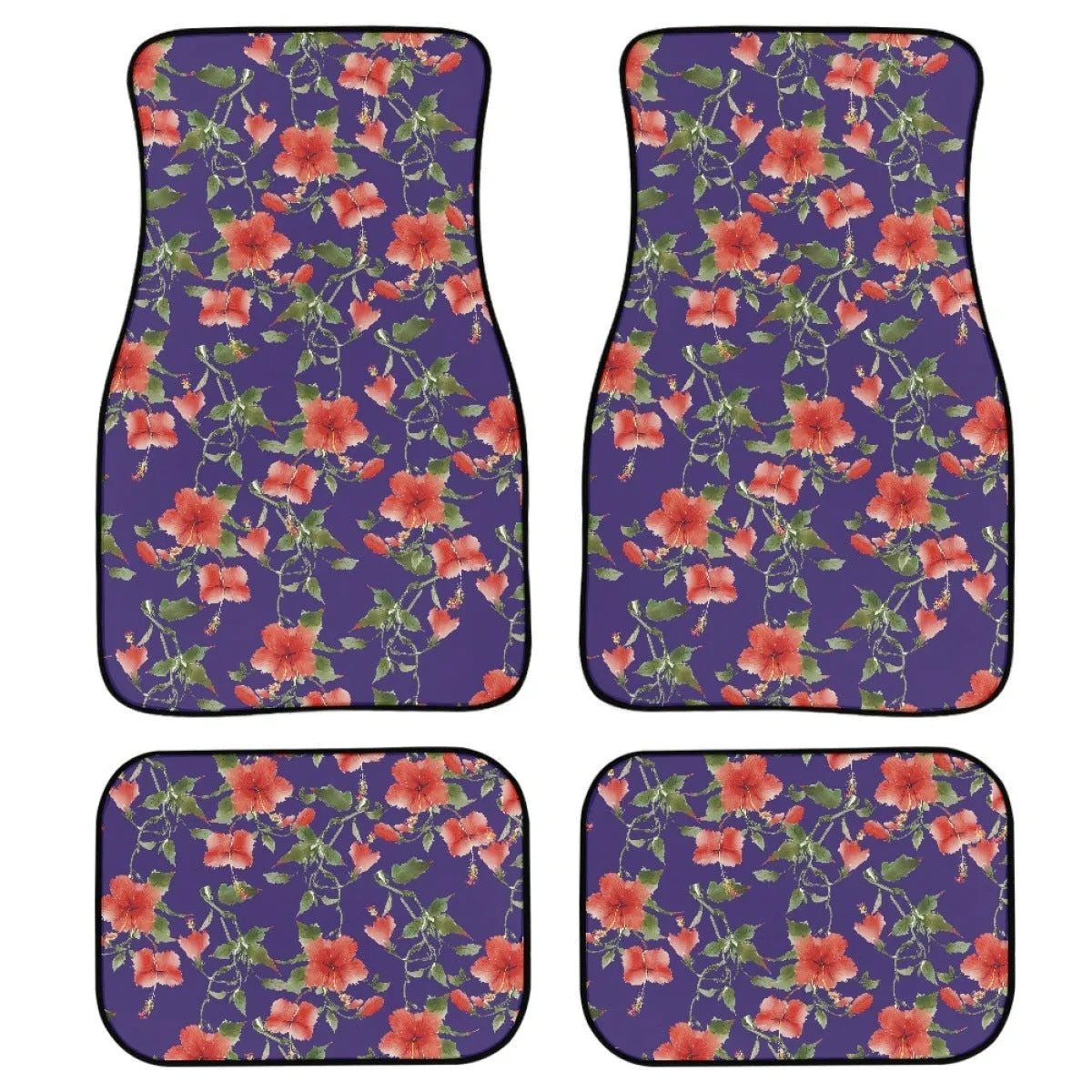 Set of four black printed rubber car floor mats with textured surface, showing thickness.