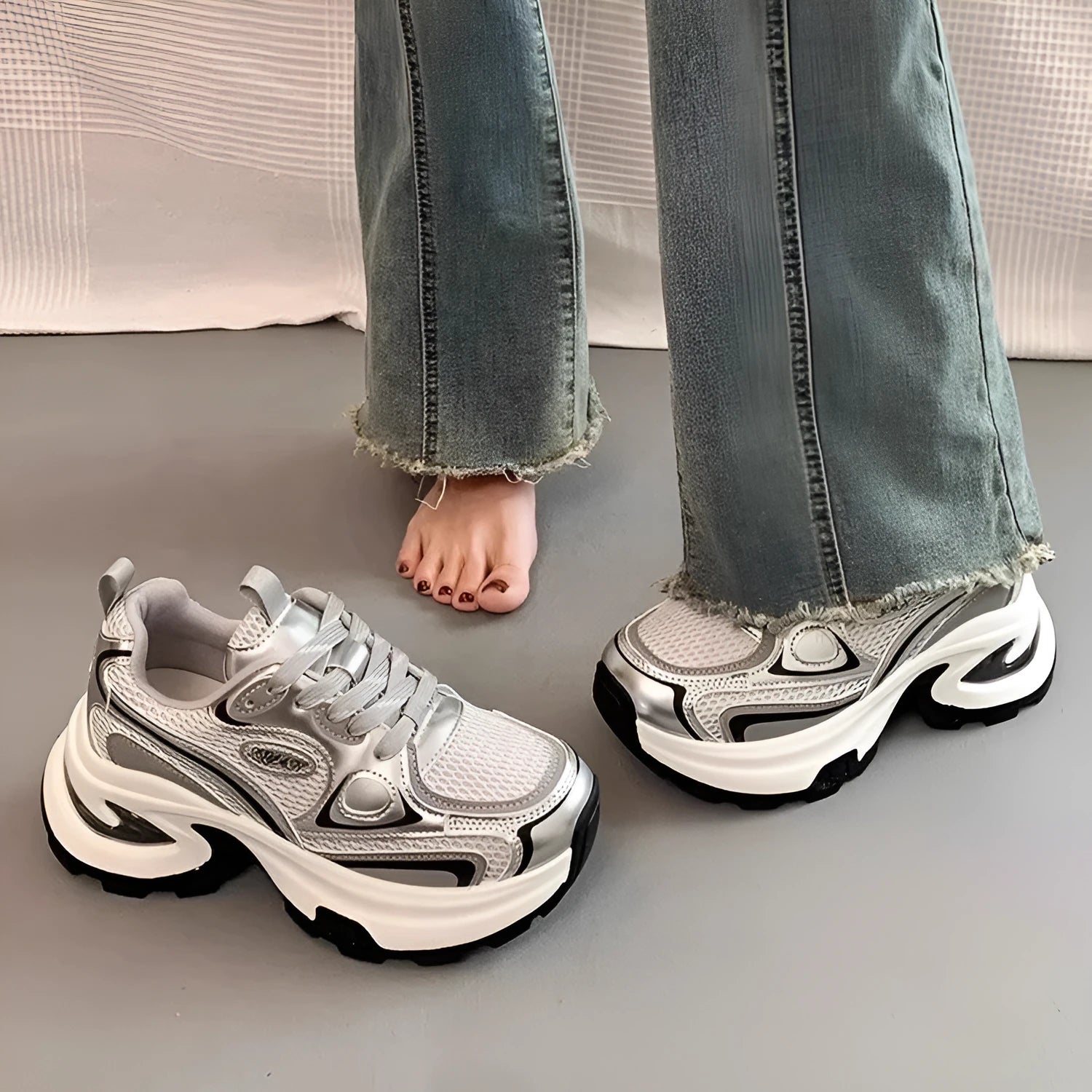 Women's silver and red mesh breathable platform sneakers with round toe and flat rubber sole.