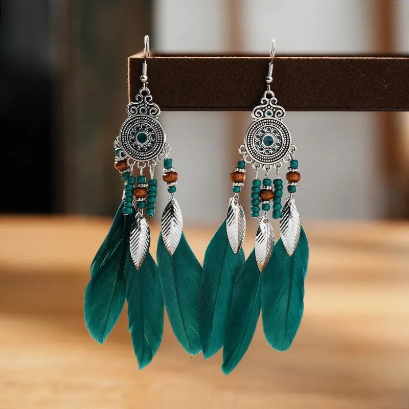 Feather-shaped drop earrings with leaf pattern in thirteen colour options on alloy metal