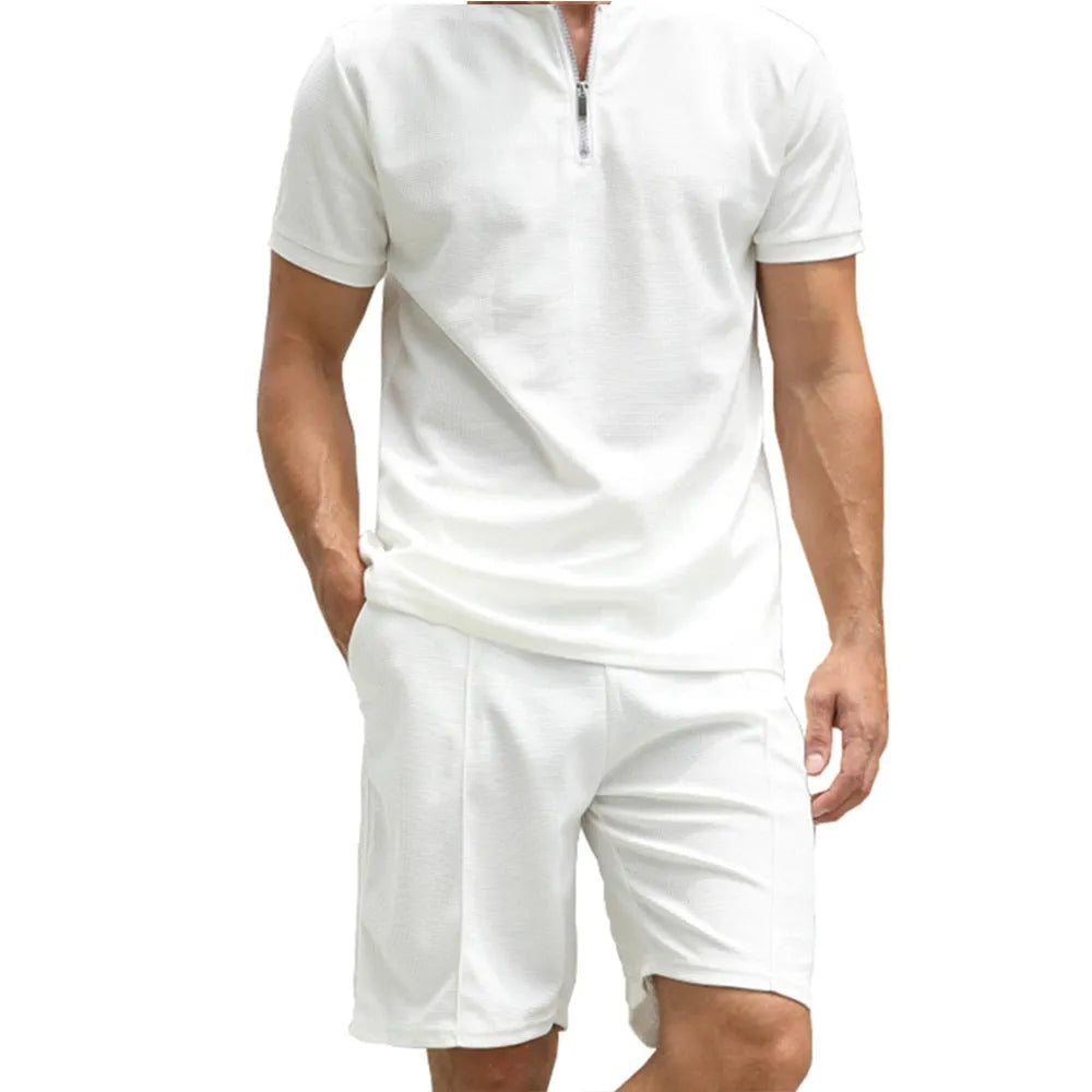 Men's solid colour polo shirt and matching trousers two-piece set in textured fabric.