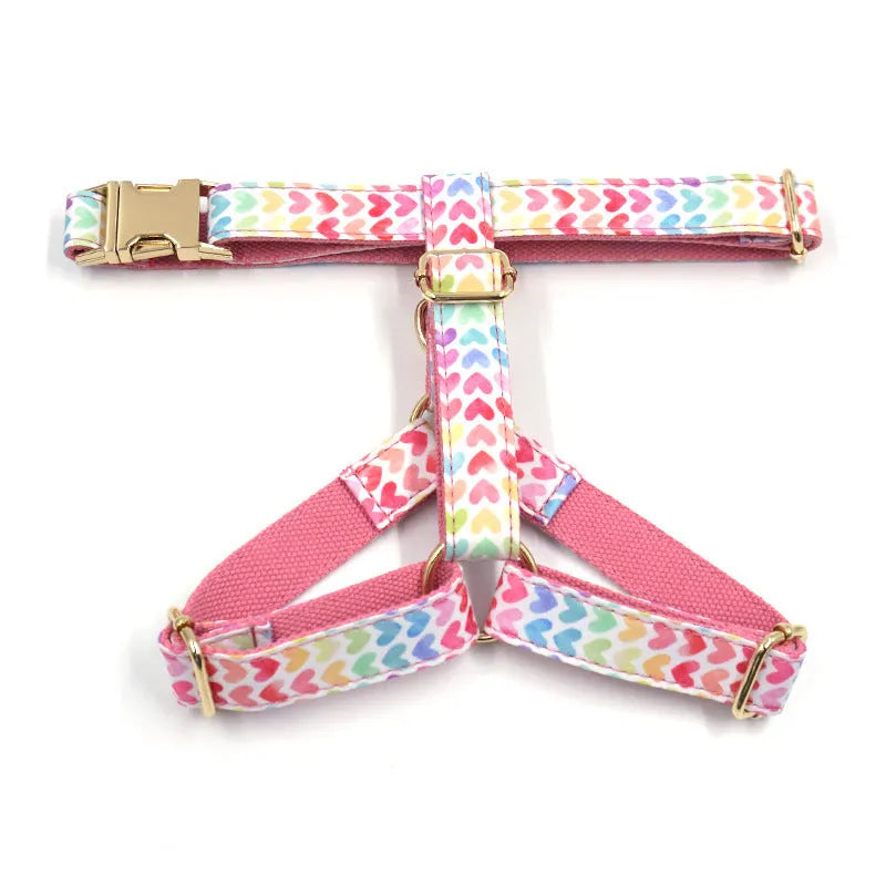 Pink colourful dog harness with gold buckle and heart-shaped stone decoration