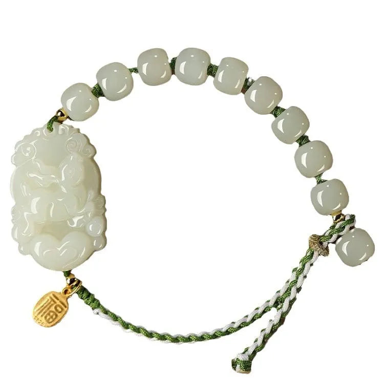 Rabbit Chinese zodiac bracelet with Hetian jade charm and silver card on a red rope.