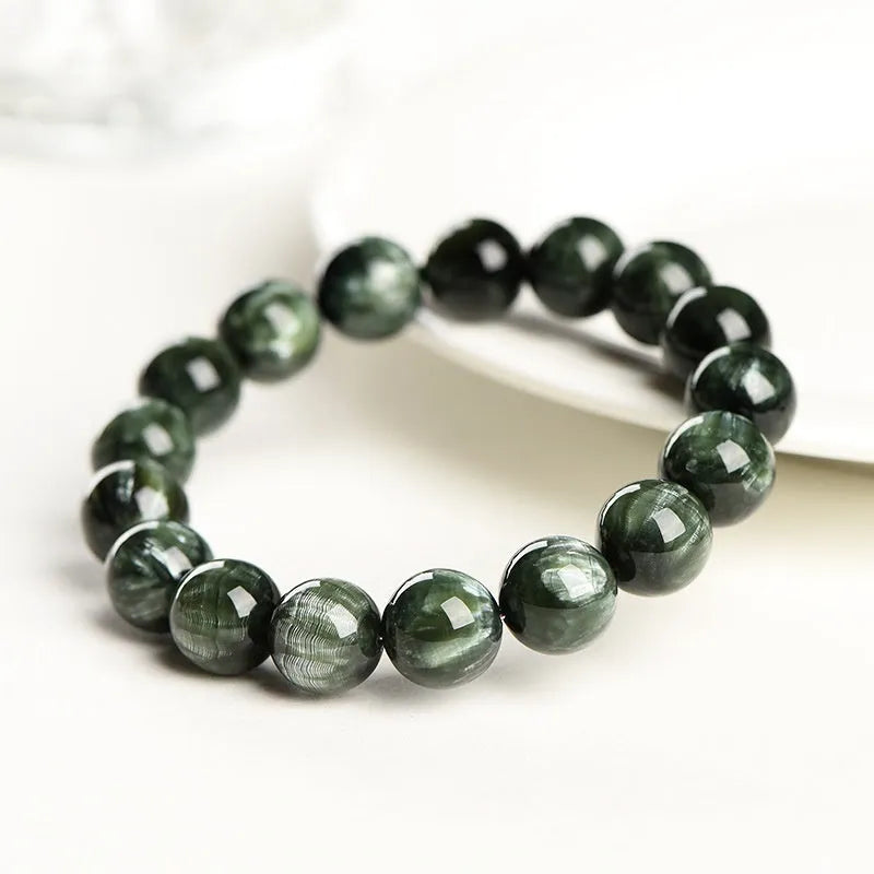 Unisex green dragon crystal bracelet with 8-9mm round beads and a Ruyi charm.