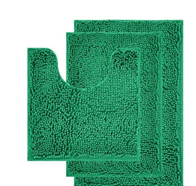 Dark green chenille U-shaped three-piece bathroom toilet carpet set on tiled floor.