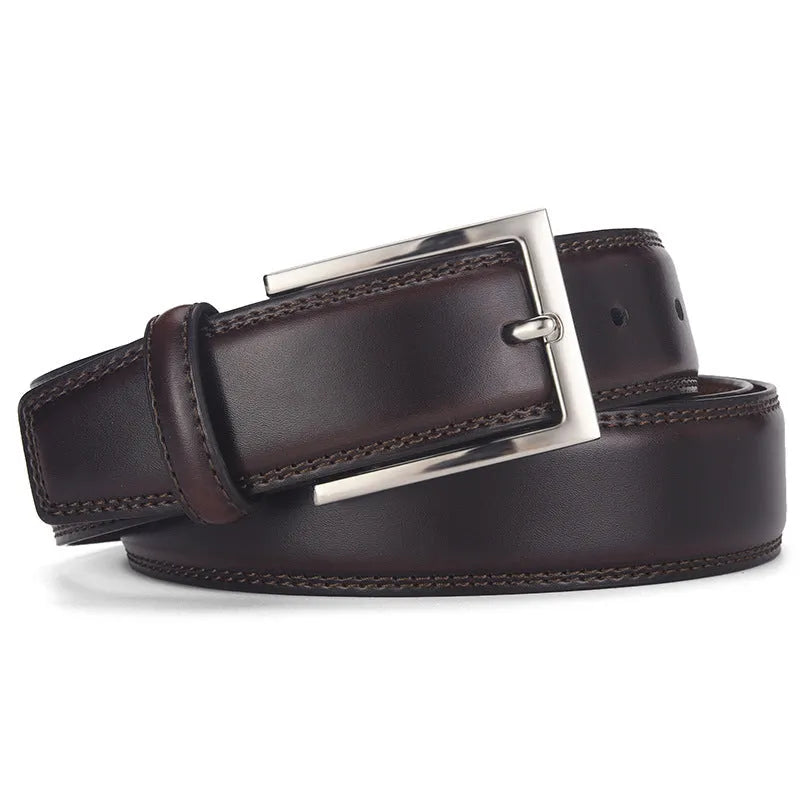 Men's black genuine leather belt with silver alloy pin buckle on a flat surface
