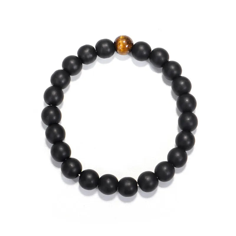 Tiger eye stone beaded necklace and bracelet set with tassel pendants on white background