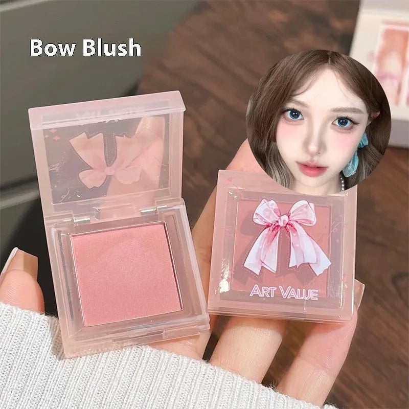 Butterfly Box pink makeup set with four matte lip muds, powder blusher, and necklace