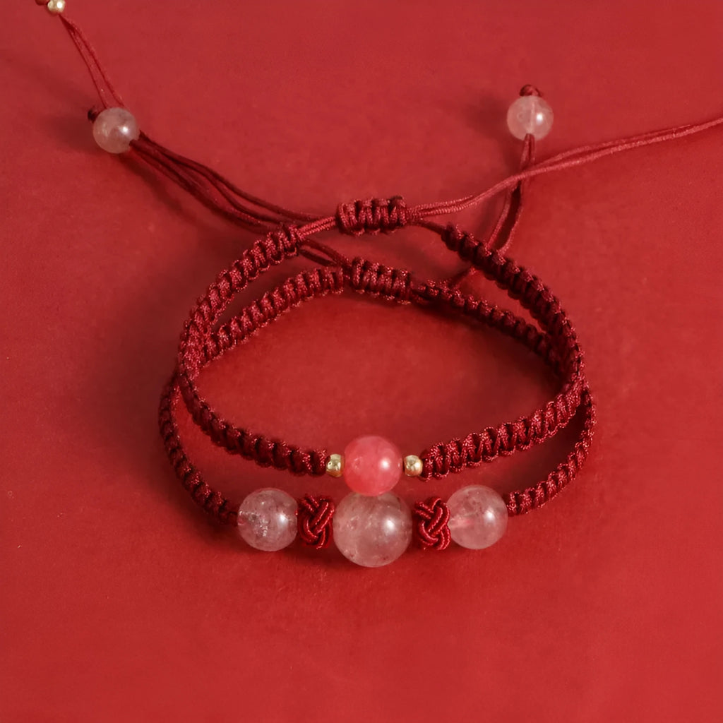 Woven red rope bracelet with alloy beads and natural strawberry quartz or obsidian stone beads