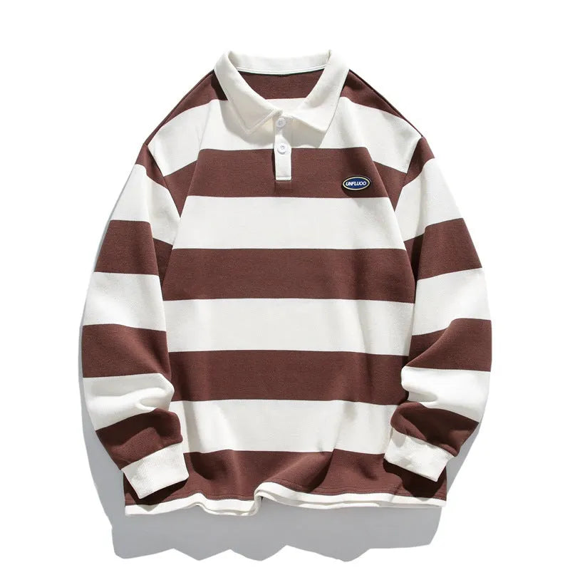 A man wearing a loose-fit, striped pearl cotton polo shirt with a lapel collar and long sleeves.