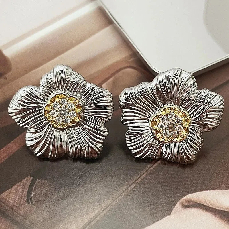 Retro copper stud earrings with textured gardenia floral design and two-tone electroplated finish