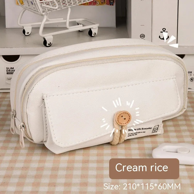 Large capacity canvas pencil case for girls in beige, blue, gray, or green, holding many pens.