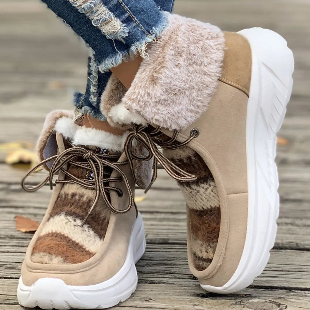 Beige women's lace-up suede snow boots with a fuzzy lining and thick rubber sole.