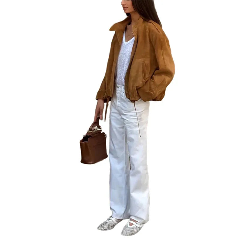 Man's solid colour retro loose-fit polyester jacket with long sleeves on a hanger.