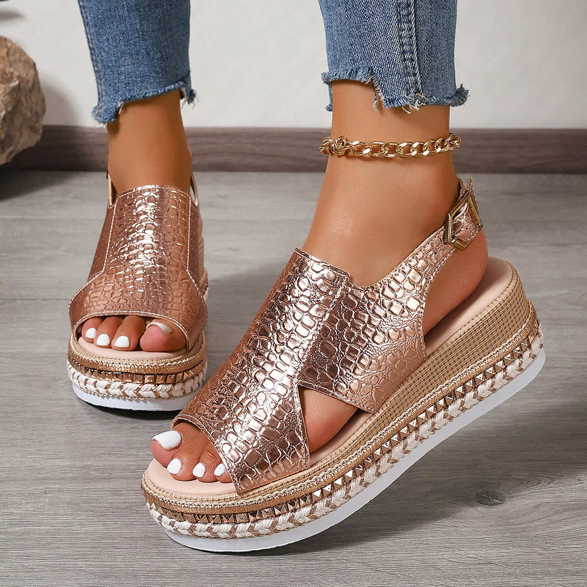 Gold women's Roman sandals with round toe, hollow-out design, and adjustable ankle buckle