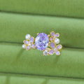 Women's open ring with floral zircon stones in light purple electroplated metal