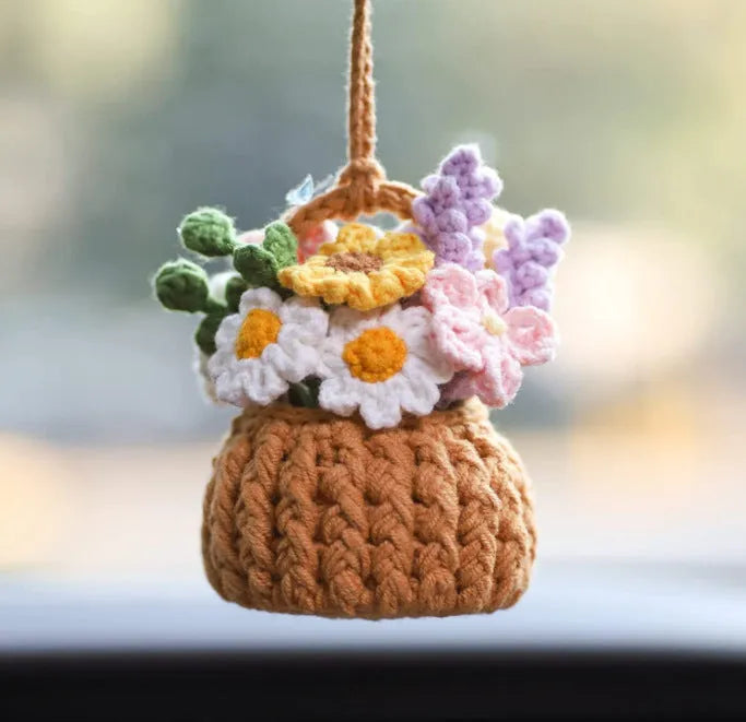Green and white knitted wool car plant decoration with 8cm base and hanging rope.