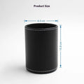 Small round black leather pen holder container showing cylindrical shape and compact dimensions