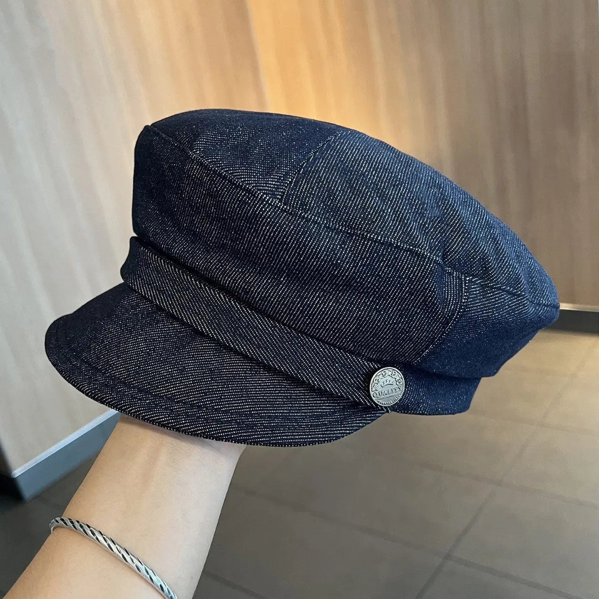 Dark blue denim octagonal newsboy hat with an adjustable fit for 54-58cm head sizes.