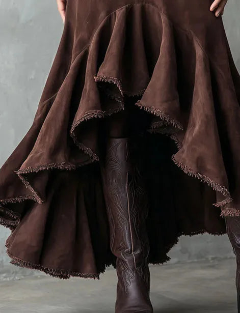 Western brown high-low maxi skirt with ruffled ankle hem laid flat.