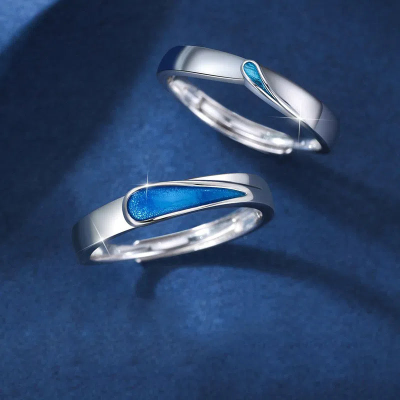 Blue tear drop shape copper ring on finger with glossy glue dripping finish