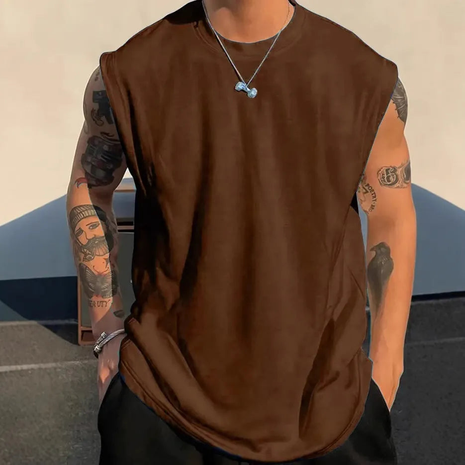 Man wearing a loose-fit solid colour cotton sleeveless tank top for summer.