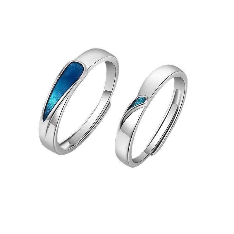 Blue tear drop shape copper ring on finger with glossy glue dripping finish