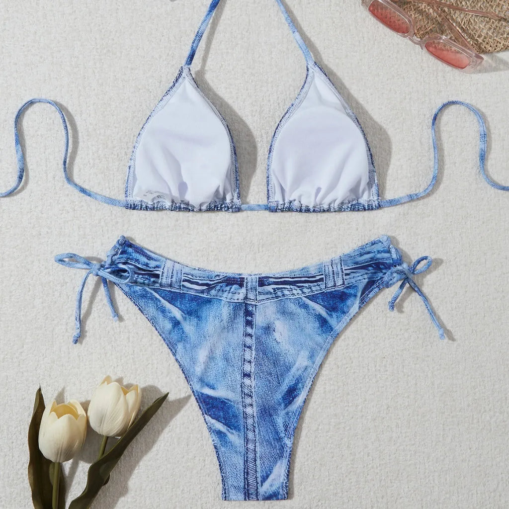Denim blue printed women's bikini set with strap design on a mannequin, showing top and bottom.
