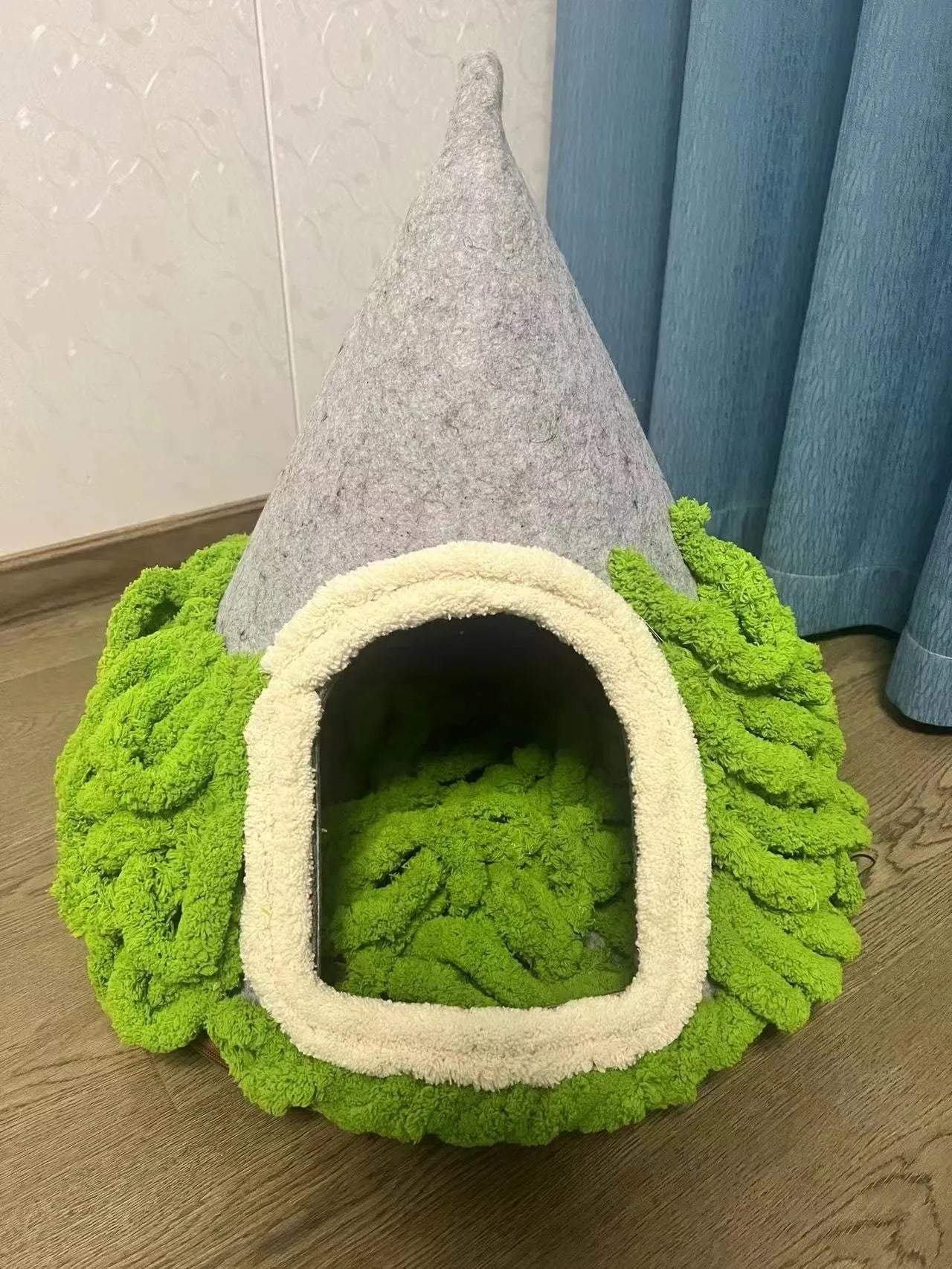 Grey cone-shaped felt cat house measuring 50cm wide with enclosed tent design