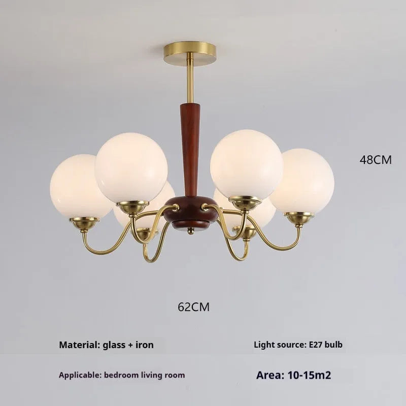 American retro persimmon chandelier with amber yellow glass shades in a dining room setting