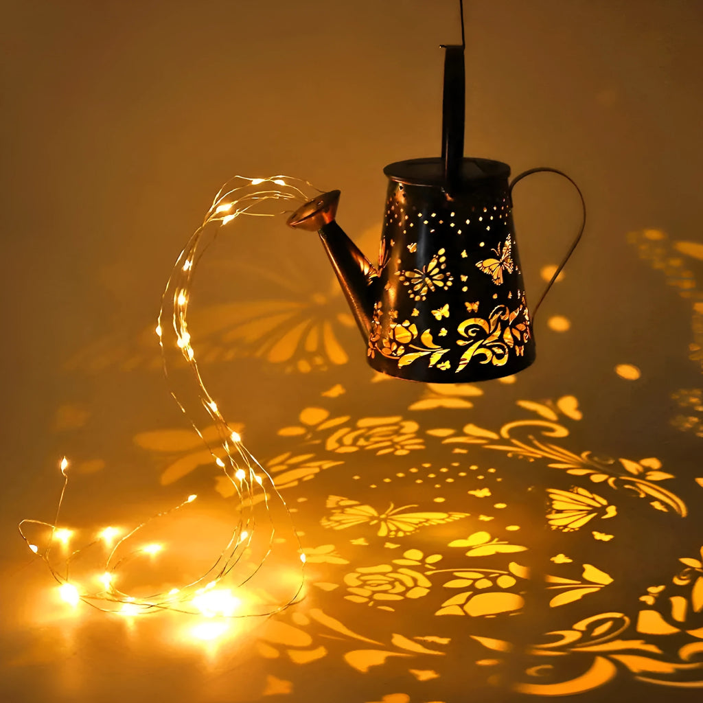 Solar-powered iron garden lantern with butterfly pattern and warm white LED light.