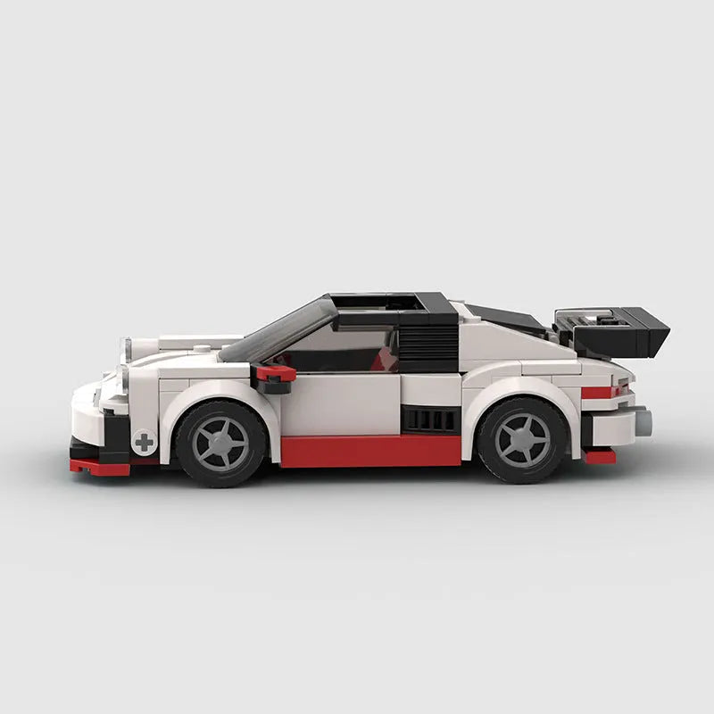 Small particle plastic building blocks model of a cool convertible sports car on a table