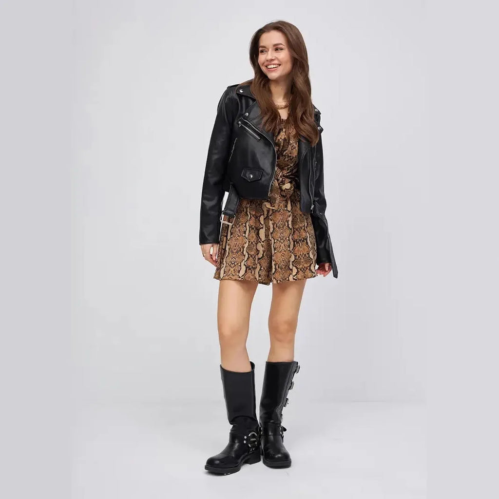 Black women's street fashion PU imitation leather coat on a hanger