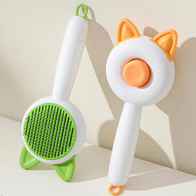 Self-cleaning pet hair comb for cats in greenish white and orange white colour options