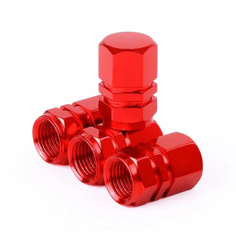 Set of ten aluminium alloy car valve caps in blue, red, silver, gold and black on a white background