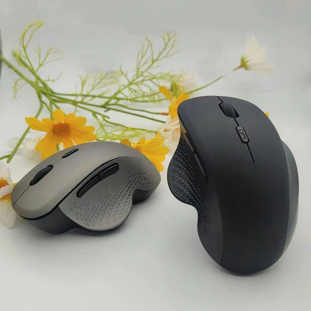 Grey and black wireless laptop mouse with USB charging cable showing compact dimensions