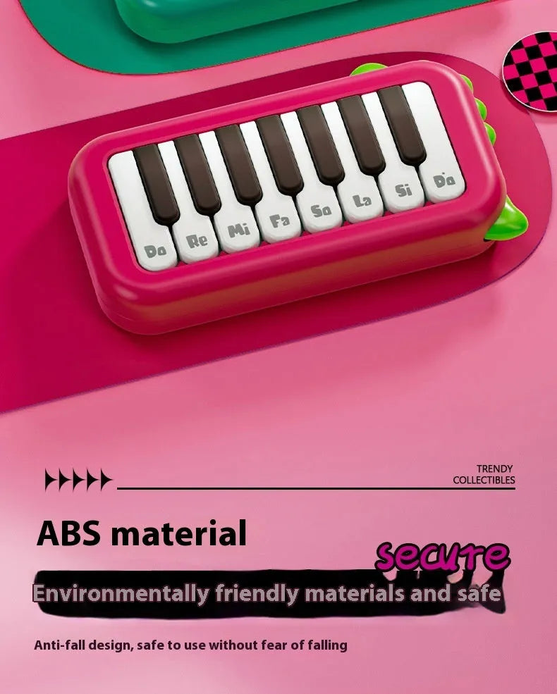 Pocket electronic keyboard toy for children in green or pink, plays little piano patterns for developmental training.