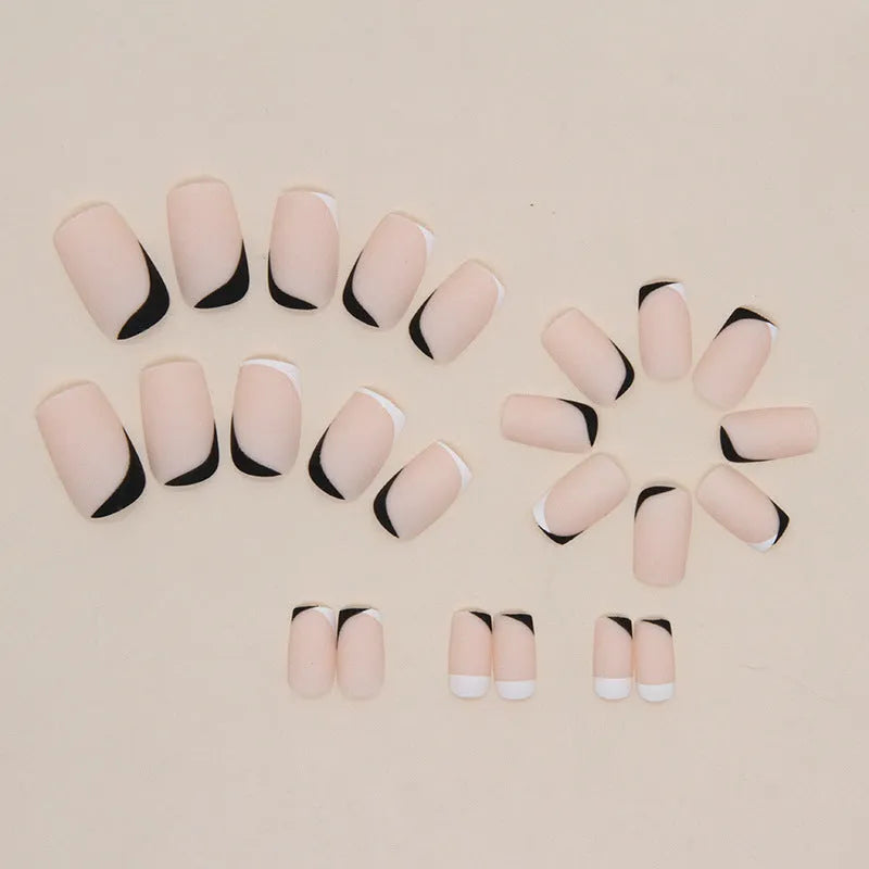 Black and white frosted matte artificial nails in a double-piece mandarin duck colour split design.