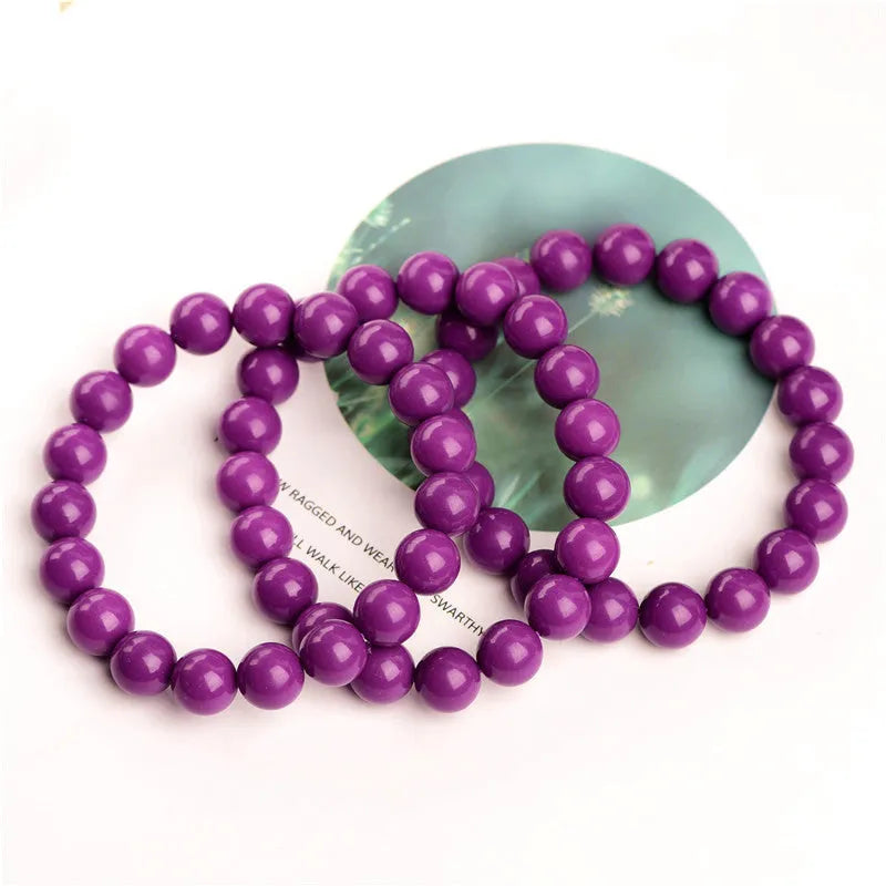 Purple mica crystal bracelet on wrist showing polished finish and single circle design.