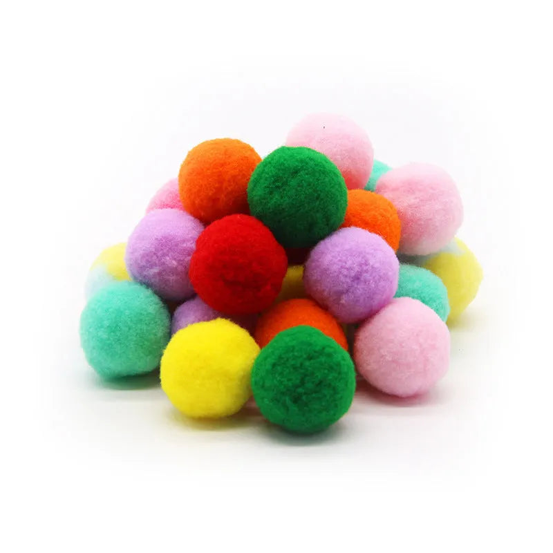Pet toy launch gun with a selection of soft red plush balls for interactive dog and cat fetch games.