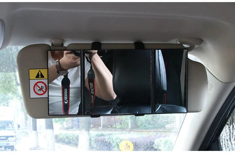 Silver car folding makeup mirror shown closed at 15.5 cm and opened at 30.5 cm wide.