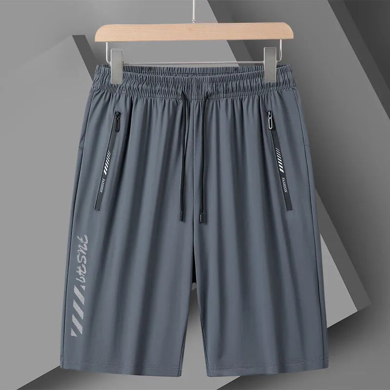 Man wearing black loose-fit quick-dry nylon sports shorts.