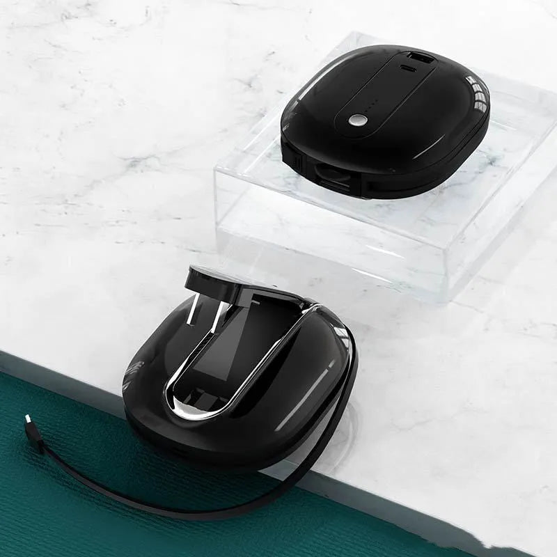 White and black two-in-one power bank with integrated plug showing 10000mAh capacity and compact size