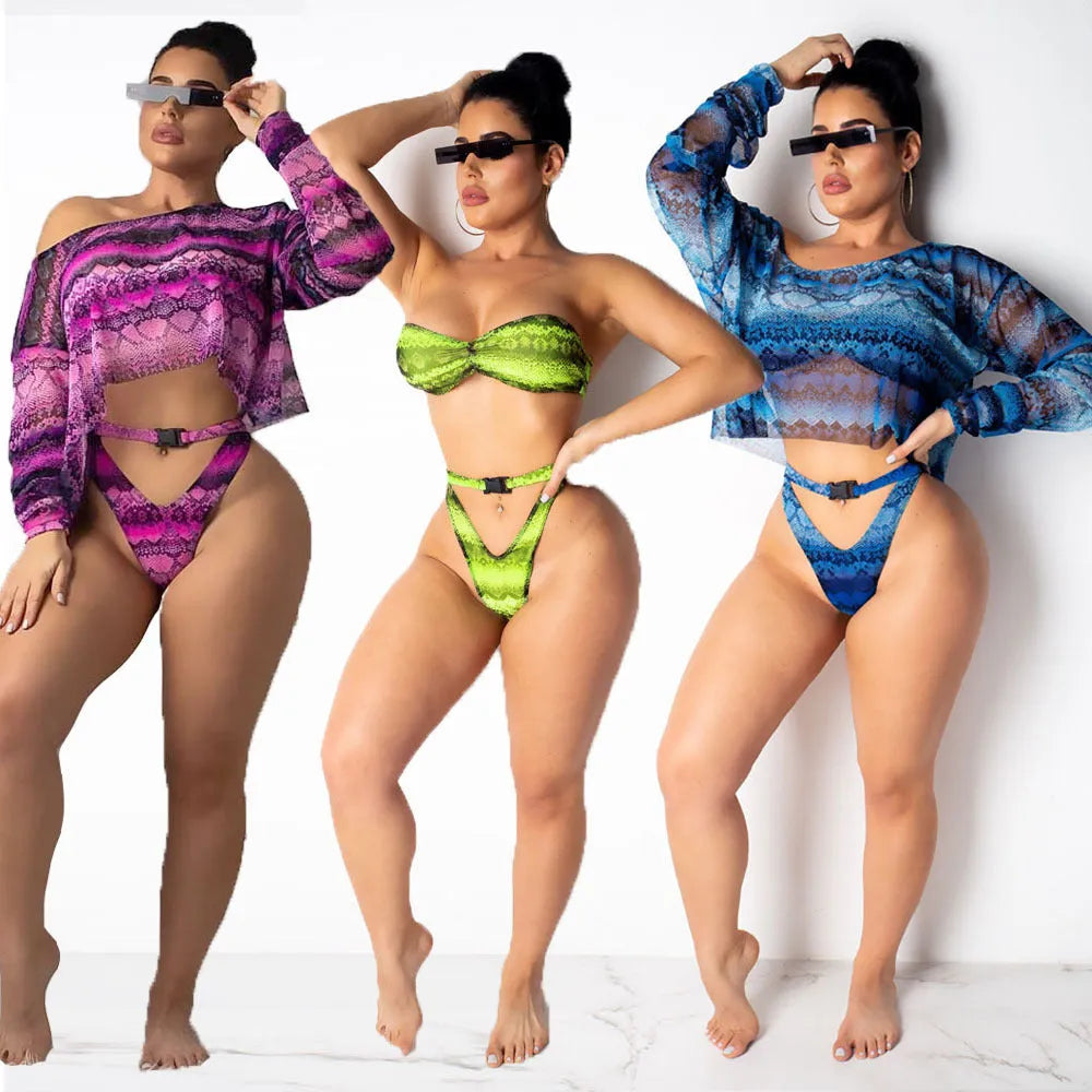 Women's purple snakeskin print bikini set with floral pattern and long sleeves.