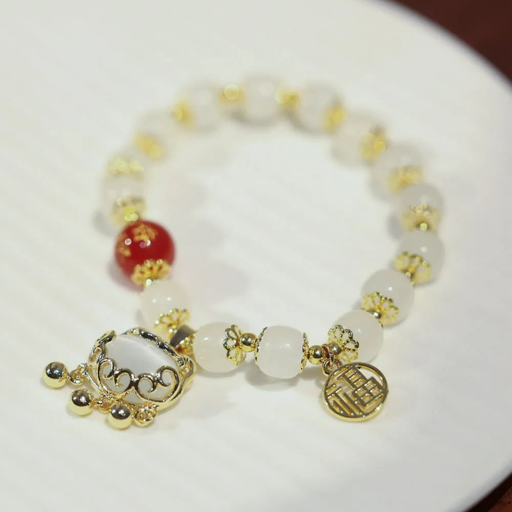 Chinese style glass bracelet with safety lock, windmill and bamboo charms for women
