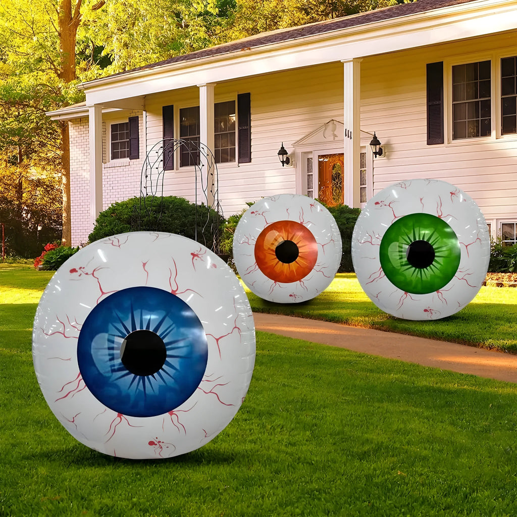 Green Halloween eyeball balloon with red bloodshot pattern, inflated to a round shape.